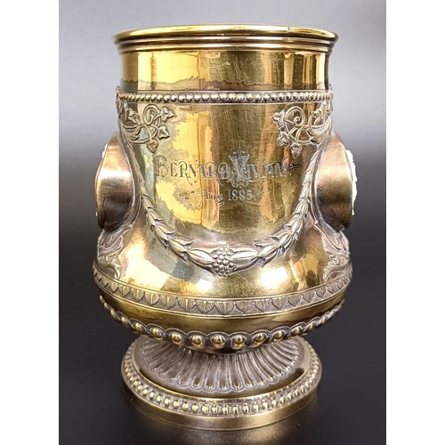 409 - An unusual Victorian silver gilt mug, inset with two carved cameos decorated classical scenes, Londo... 