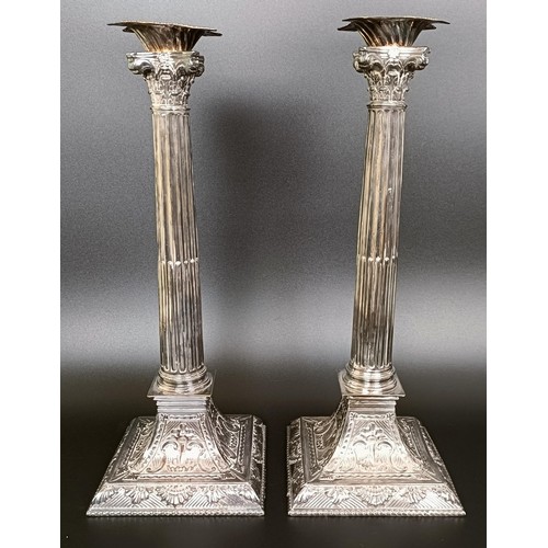 410 - A pair of silver plated candlesticks, in the form of Corinthian columns, 35 cm high (2)