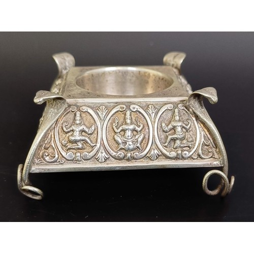 309 - An Eastern silver coloured metal compact, three salts, and an ashtray (5)