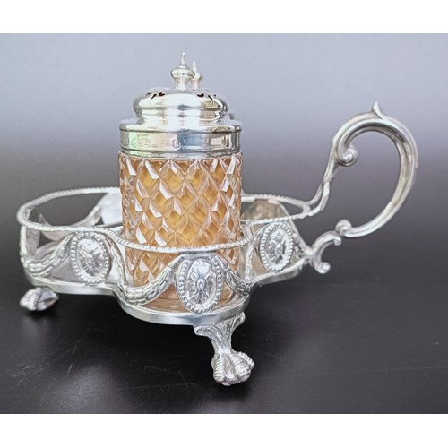 310 - A Victorian silver cruet stand, London 1894, 6.53 ozt, and two silver mounted condiment jars (3)