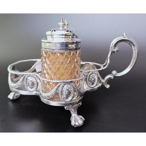 310 - A Victorian silver cruet stand, London 1894, 6.53 ozt, and two silver mounted condiment jars (3)