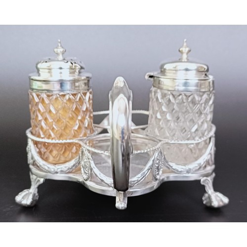 310 - A Victorian silver cruet stand, London 1894, 6.53 ozt, and two silver mounted condiment jars (3)