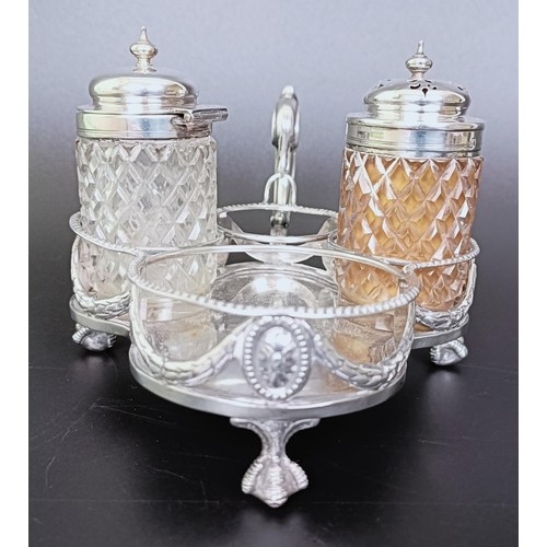 310 - A Victorian silver cruet stand, London 1894, 6.53 ozt, and two silver mounted condiment jars (3)