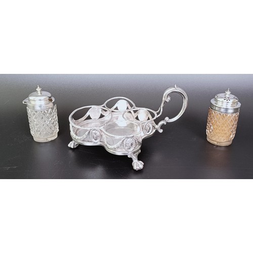 310 - A Victorian silver cruet stand, London 1894, 6.53 ozt, and two silver mounted condiment jars (3)