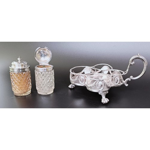 310 - A Victorian silver cruet stand, London 1894, 6.53 ozt, and two silver mounted condiment jars (3)