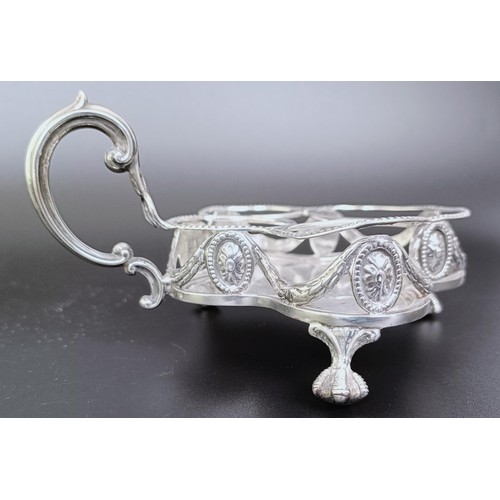 310 - A Victorian silver cruet stand, London 1894, 6.53 ozt, and two silver mounted condiment jars (3)