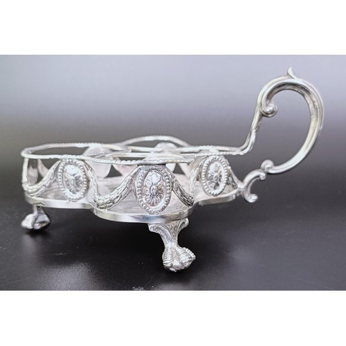 310 - A Victorian silver cruet stand, London 1894, 6.53 ozt, and two silver mounted condiment jars (3)