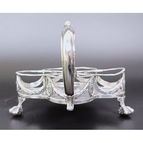 310 - A Victorian silver cruet stand, London 1894, 6.53 ozt, and two silver mounted condiment jars (3)