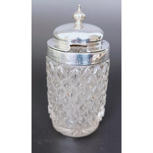 310 - A Victorian silver cruet stand, London 1894, 6.53 ozt, and two silver mounted condiment jars (3)