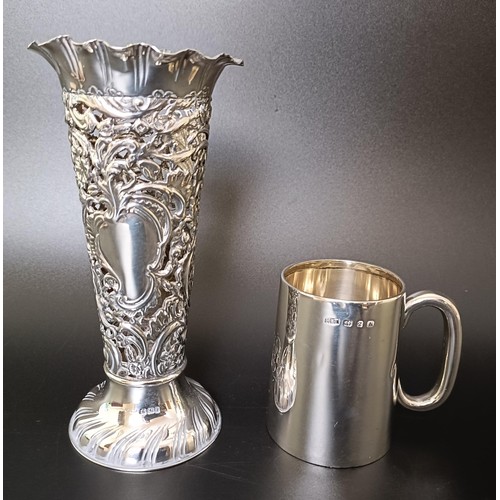 312 - A George V silver mug, and a pierced silver posy vase, 7.1 ozt (2)