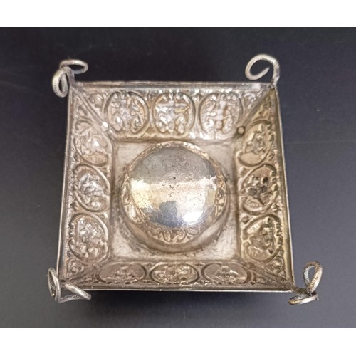 313 - An Eastern silver coloured metal ashtray, a snuff box, a matchbox holder, and another ashtray (4)