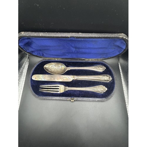 318 - A Victorian silver three piece christening set, monogrammed, London 1866/1867, cased