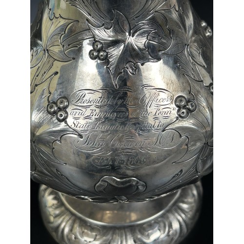 4 - An American silver coloured metal jug, inscribed Presented to Officers and Employees of Penn State L... 