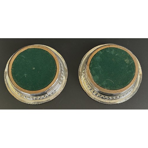 25 - A pair of Georgian silver wine coasters, marks rubbed, 16.52 cm diameter (2)