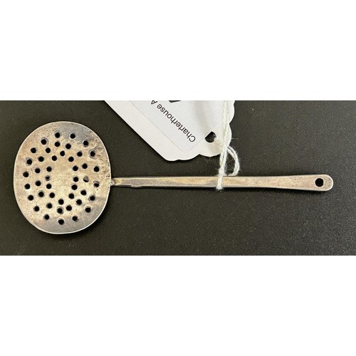 41 - An 18th century Dutch silver coloured metal straining spoon...