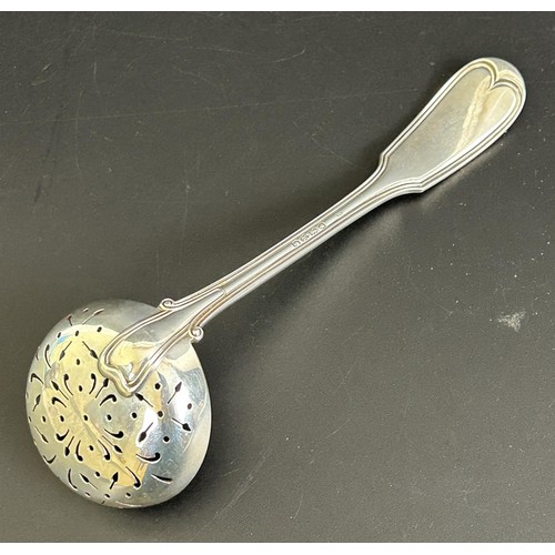 47 - A Victorian silver sifting spoon, with fish crest, London 1885, 2.1 ozt