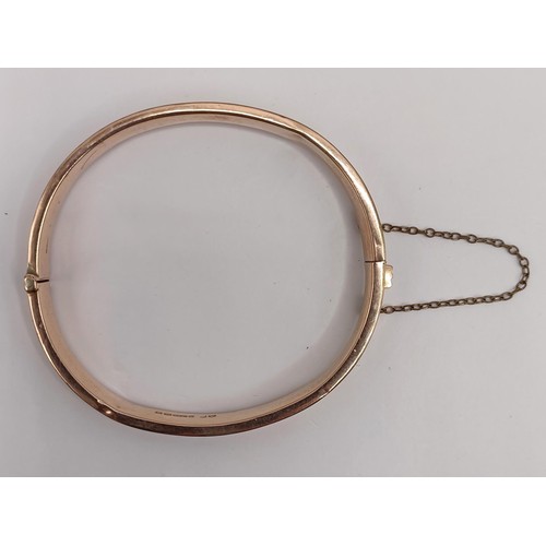 800 - A 9ct gold bangle, 9.3 g