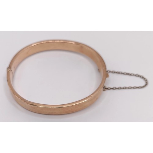 800 - A 9ct gold bangle, 9.3 g