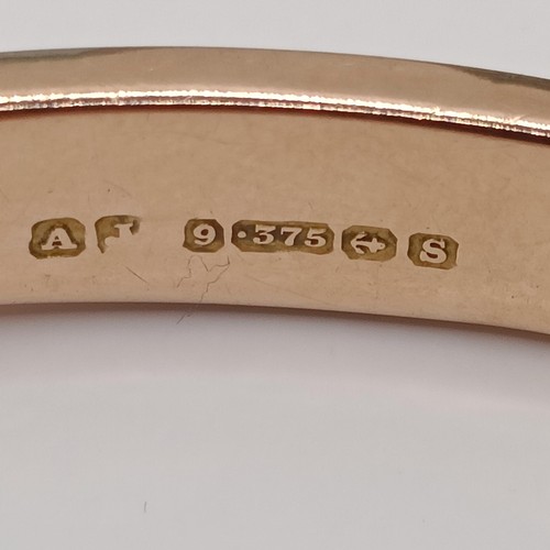 800 - A 9ct gold bangle, 9.3 g