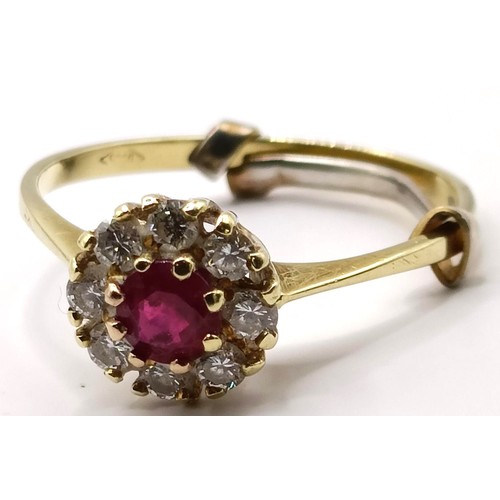 751 - An 18ct gold, ruby and diamond cluster ring, ring size K