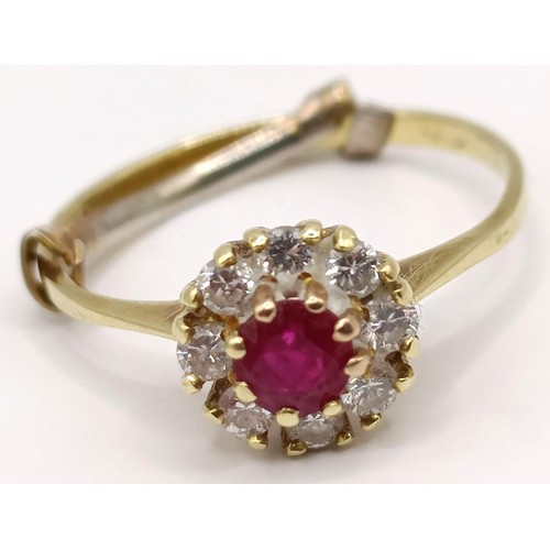 751 - An 18ct gold, ruby and diamond cluster ring, ring size K