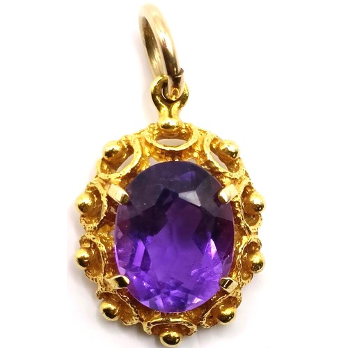 748 - An amethyst and yellow metal pendant