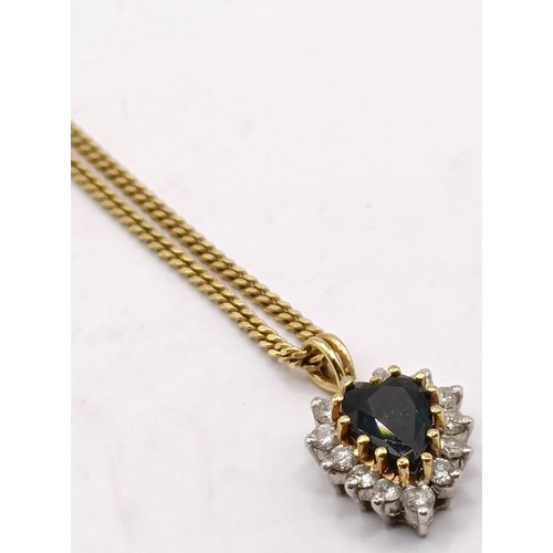 807 - A sapphire and diamond pendant, on a 9ct gold chain