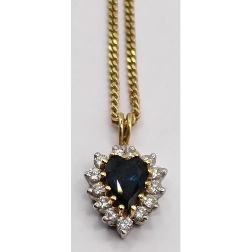 807 - A sapphire and diamond pendant, on a 9ct gold chain