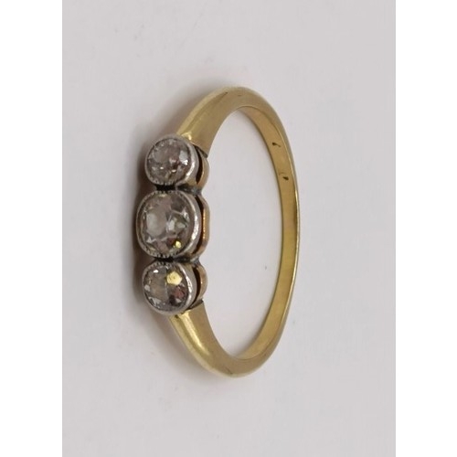 602 - A three stone diamond ring, ring size NProvenance:  Sold on behalf of Dorset Wildlife Trust