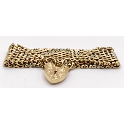 746 - A 9ct multi-coloured gold bracelet, with a heart shaped padlock clasp, 42.5 g