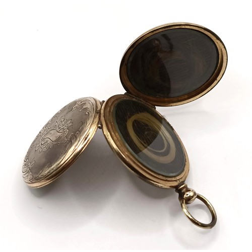 808 - Photographic Interest: An unusual mid Victorian memorial brooch, with two hinged covers, one reveali... 