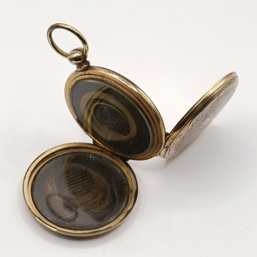 808 - Photographic Interest: An unusual mid Victorian memorial brooch, with two hinged covers, one reveali... 