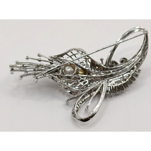 736 - An 18ct white gold, diamond and pearl brooch