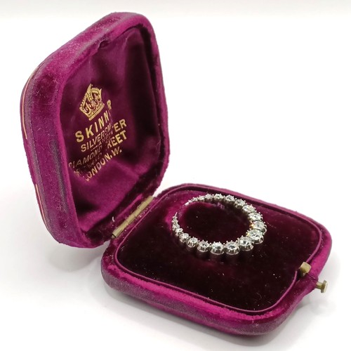 743 - An early 20th century diamond crescent brooch, in a vintage jewellery box, retail mark for Skinner o... 