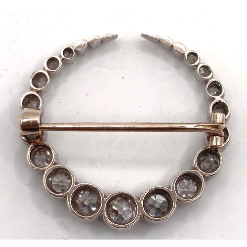 743 - An early 20th century diamond crescent brooch, in a vintage jewellery box, retail mark for Skinner o... 