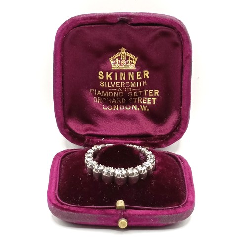 743 - An early 20th century diamond crescent brooch, in a vintage jewellery box, retail mark for Skinner o... 