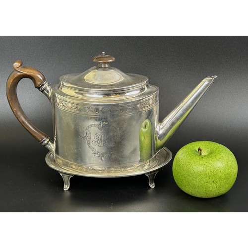 413 - A George III silver teapot and stand, monogrammed, with bright cut decoration, London 1794, 21.0 ozt... 