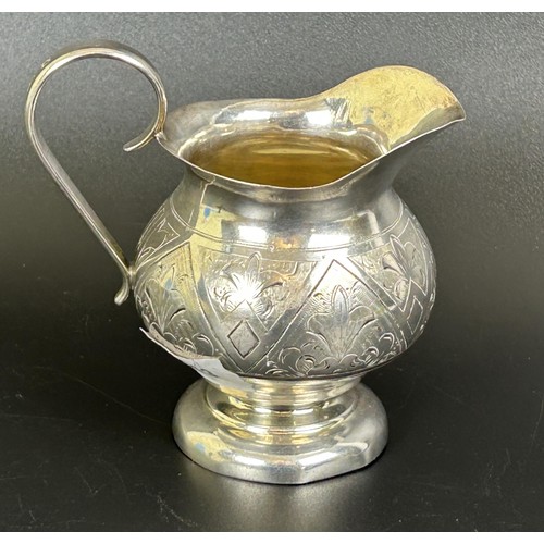 290 - A Russian silver coloured metal jug, with engraved decoration, 4.2 ozt, 10.5 cm high