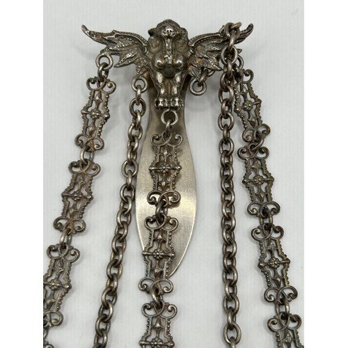 298 - A Victorian silver chatelaine, Birmingham 1890, the chains with two silver propelling pencils