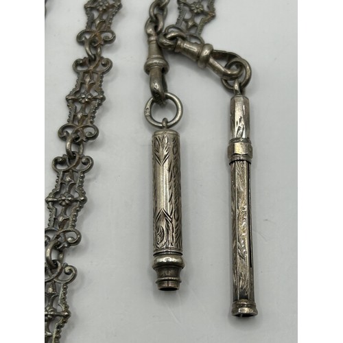 298 - A Victorian silver chatelaine, Birmingham 1890, the chains with two silver propelling pencils