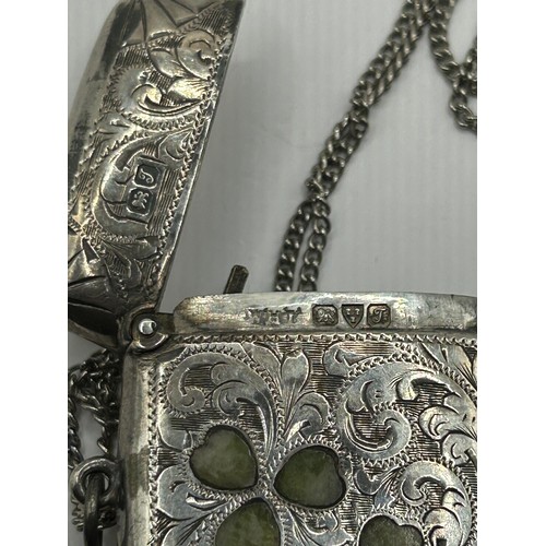 296 - A George V silver vesta case, set hardstone shamrocks, Chester 1919, 25.4 g (all in), 4.5 cm high