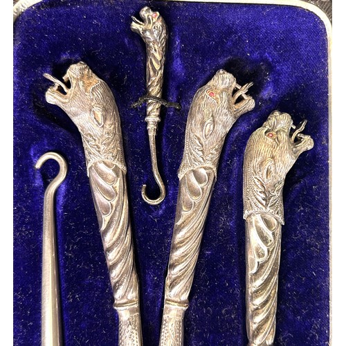 306 - A Cartier style dressing set, with silver tiger's head mounts, cased