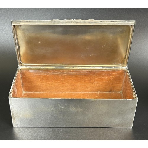 324 - A Victorian silver box, London 1900, 17.5 cm wide, and assorted miniature books