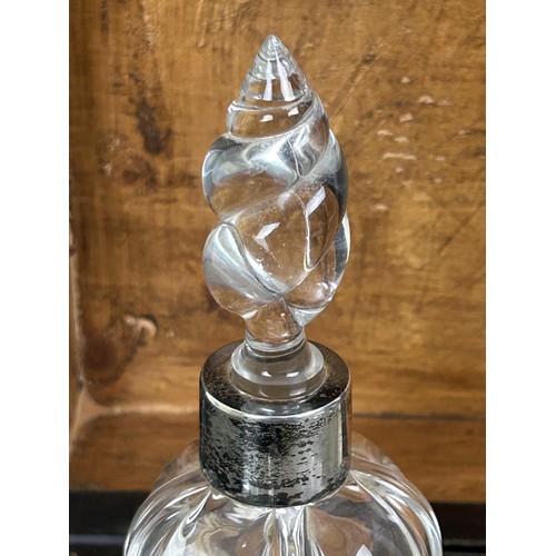 327 - A cut glass atomiser, with a silver mount, and assorted silver mounted glass bottles, in a walnut bo... 