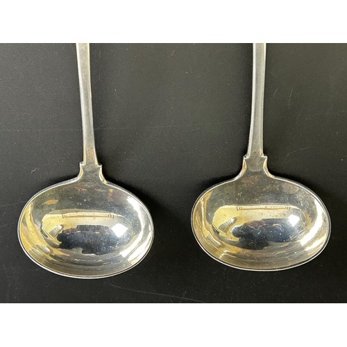 371 - A pair of Scottish provincial silver fiddle pattern sauce ladles, 1.7 ozt