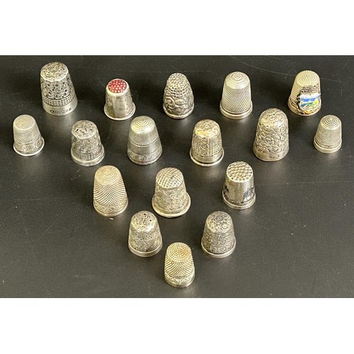 375 - A silver thimble, and fourteen other silver and silver coloured metal thimbles (15)