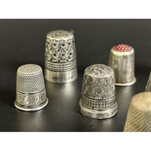 375 - A silver thimble, and fourteen other silver and silver coloured metal thimbles (15)