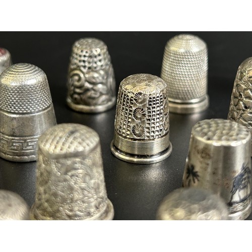 375 - A silver thimble, and fourteen other silver and silver coloured metal thimbles (15)