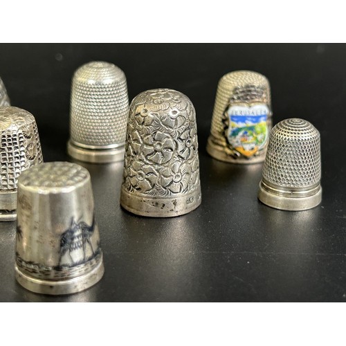 375 - A silver thimble, and fourteen other silver and silver coloured metal thimbles (15)