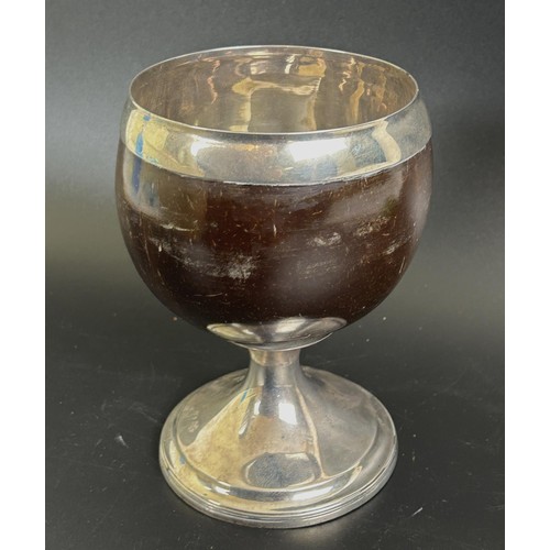 400 - A George III Scottish coconut cup, crested, on silver pedestal base, P Cunningham & Son, Edinbur... 